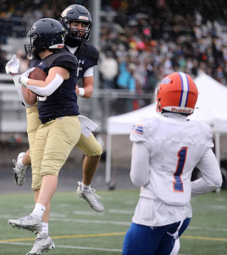 Arlington senior offensive lineman Alex Cunningham celebrates a two-point conversion with senior wide receiver Jake Willis during a first-round game of the Class 4A state tournament against Graham-Kapowsin in Arlington, Wash., on Saturday, Nov. 16, 2024. The Eagles won, 42-6. (Taras McCurdie / The Herald)