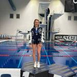 Glacier Peak High School diver Addison Farman stands on the championship platform after winning her second straight Class 4A 1-meter diving title at the King Country Aquatics Center on Thursday, Nov. 14, 2024. (Photo courtesy of Jamie Farman)