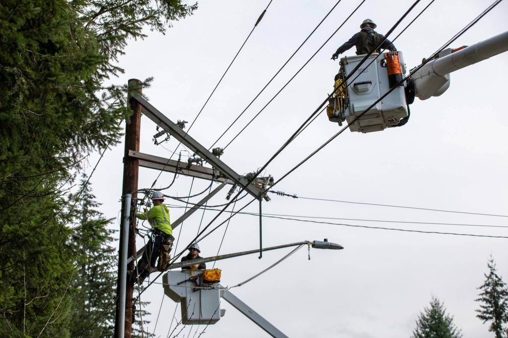 Snohomish County PUD crew members work to repair a broken crossarm along North Machias Road on Wednesday afternoon in Lake Stevens. (Photo provided by Krysta Rasmussen / Snohomish PUD)