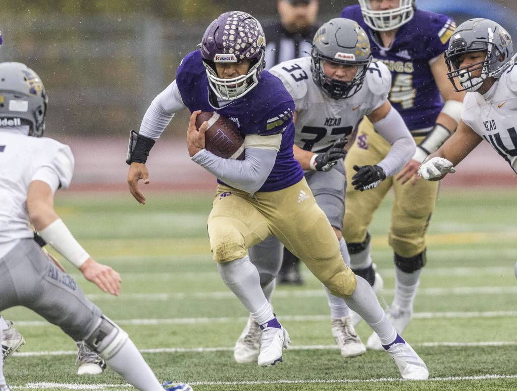 Lake Stevens’ Jayshon Limar runs the ball during the 4A state playoff game against Mead on Saturday, Nov. 16, 2024 in Lake Stevens, Washington. (Olivia Vanni / The Herald)