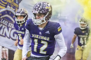 Lake Stevens Kolton Matson runs onto the field with his teammates before the start of the 4A state playoff game against Mead on Saturday, Nov. 16, 2024 in Lake Stevens, Washington. (Olivia Vanni / The Herald)