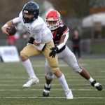Camas sophomore Thor Brody (8) tackles Arlington senior quarterback Leyton Martin on Saturday, Nov. 23, 2024, during the Papermakers 35-21 win against Arlington in a quarterfinal playoff game at Doc Harris Stadium in Camas. (Taylor Balkom / The Columbian)