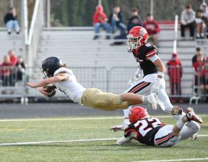 Arlington senior Chase Deberry dives into the end zone Saturday, Nov. 23, 2024, during the Eagles 35-21 loss to Camas in a quarterfinal playoff game at Doc Harris Stadium in Camas. (Taylor Balkom / The Columbian)