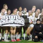 Players and coaches for the eighth-seeded Lake Stevens High School girls soccer team celebrate their 1-0 victory against second-seeded Woodinville in the Class 4A state title game at Sparks Stadium in Puyallup, Wash., on Saturday, Nov. 23, 2024. This marked the first state title in program history for the Vikings. (Taras McCurdie / The Herald)