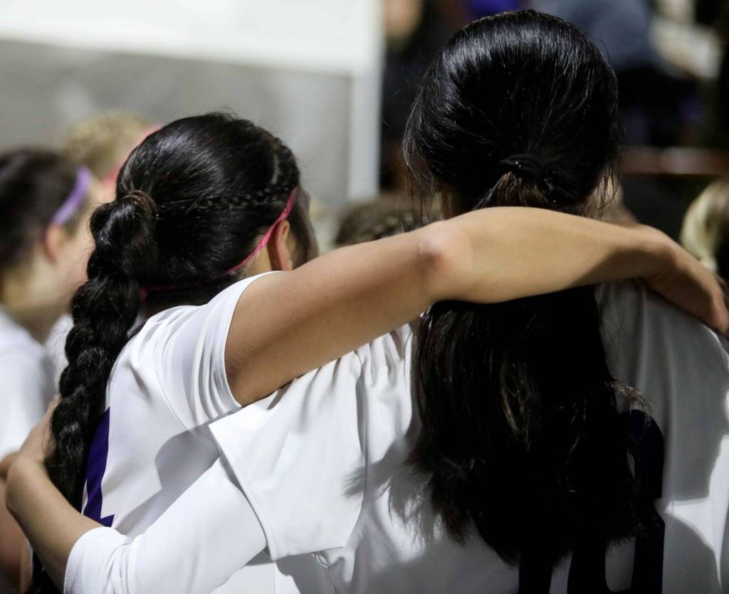 Lake Stevens sisters Keira Tupua, left, and Noelani embrace each other after a 1-0 win against second-seeded Woodinville in the Class 4A state title game at Sparks Stadium in Puyallup, Wash., on Saturday, Nov. 23, 2024. This marked the first state title in program history for the Vikings. (Taras McCurdie / The Herald)
