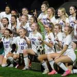 Players for the eighth-seeded Lake Stevens High School girls soccer team celebrate their 1-0 victory against second-seeded Woodinville in the Class 4A state title game at Sparks Stadium in Puyallup, Wash., on Saturday, Nov. 23, 2024. This marked the first state title in program history for the Vikings. (Taras McCurdie / The Herald)