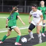Lake Stevens junior forward Keira Tupua dribbles the ball in the Class 4A state title game against second-seeded Woodinville at Sparks Stadium in Puyallup, Wash., on Saturday, Nov. 23, 2024. This marked the first state title in program history for the Vikings. (Taras McCurdie / The Herald)