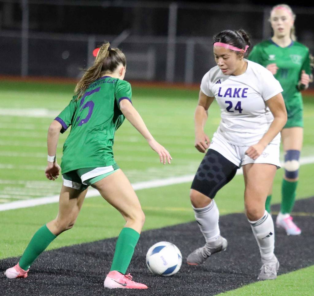 Lake Stevens junior forward Keira Tupua dribbles the ball in the Class 4A state title game against second-seeded Woodinville at Sparks Stadium in Puyallup, Wash., on Saturday, Nov. 23, 2024. This marked the first state title in program history for the Vikings. (Taras McCurdie / The Herald)