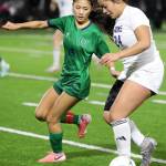 Lake Stevens junior forward Keira Tupua dribbles the ball in the Class 4A state title game against second-seeded Woodinville at Sparks Stadium in Puyallup, Wash., on Saturday, Nov. 23, 2024. This marked the first state title in program history for the Vikings. (Taras McCurdie / The Herald)