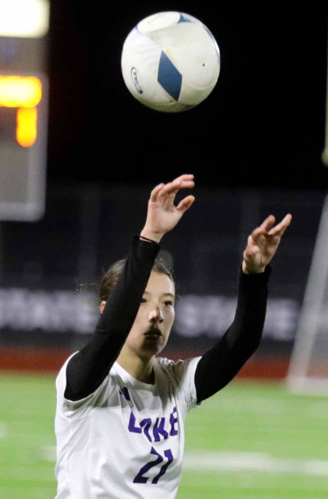 Lake Stevens sophomore midfielder Mia Ingram throws the ball into play in the Class 4A state title game against second-seeded Woodinville at Sparks Stadium in Puyallup, Wash., on Saturday, Nov. 23, 2024. This marked the first state title in program history for the Vikings. (Taras McCurdie / The Herald)