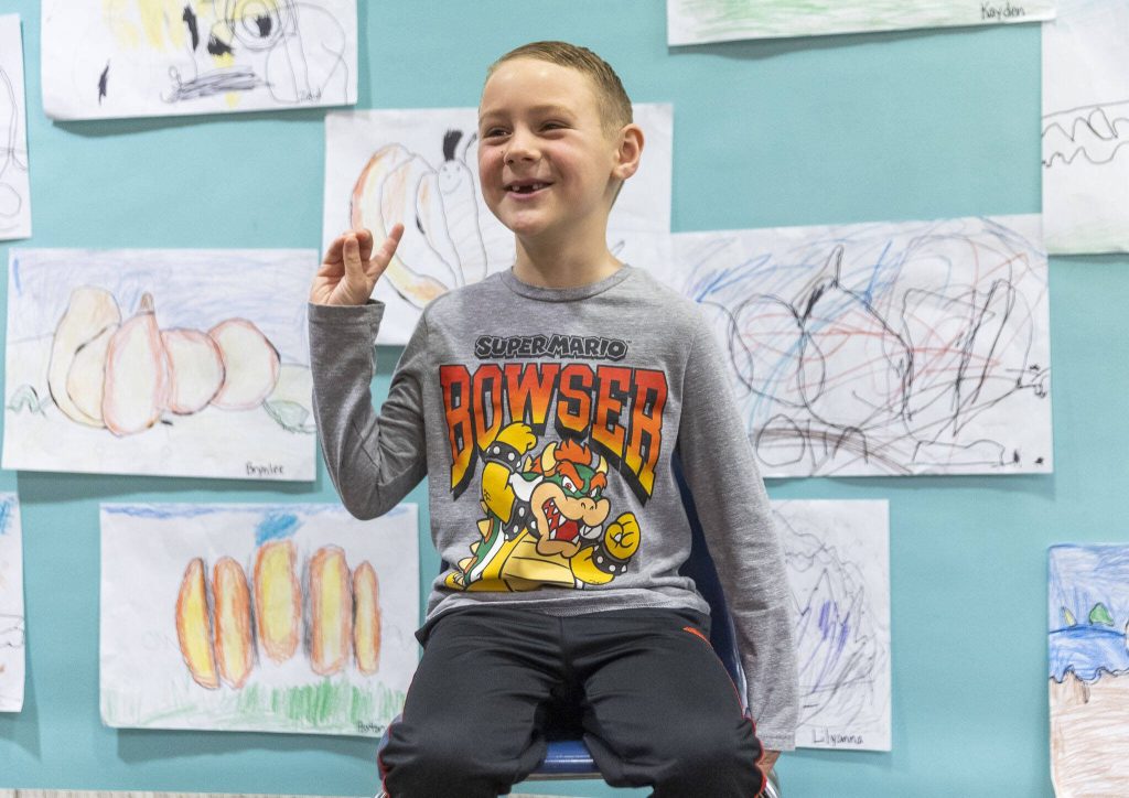Highland Elementary kindergartener Carter Bachand, 6, talks about how much turkey he eats at Thanksgiving on Tuesday, Nov. 26, 2024 in Lake Stevens, Washington. (Olivia Vanni / The Herald)