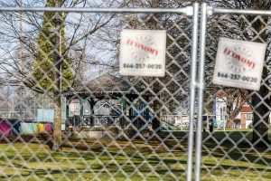 A chain link fence surrounds Clark Park on Friday, Nov. 29, 2024 in Everett, Washington.  (Olivia Vanni / The Herald)