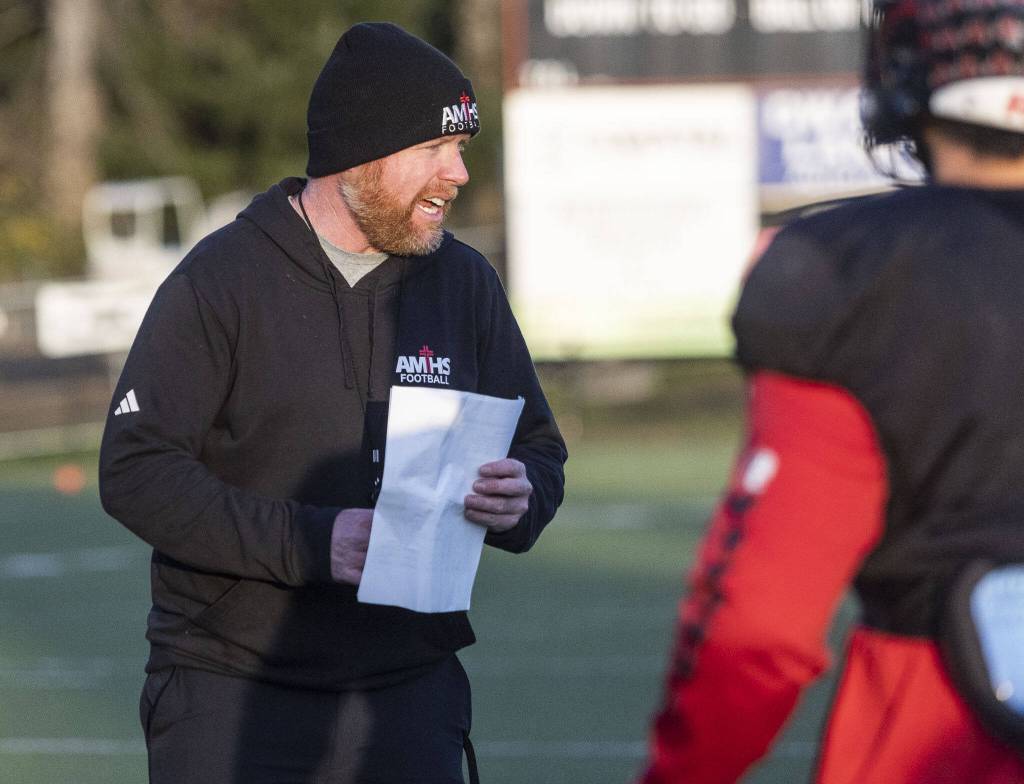 Archbishop Murphy head coach Joe Cronin talks his players through a drill during football practice on Wednesday, Nov. 27, 2024 in Everett, Washington. (Olivia Vanni / The Herald)