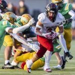 Archbishop Murphys Jevin Madison escapes multiple tackles while running the ball during the 2A semifinal game against Tumwater on Saturday, Nov. 30, 2024 in Tumwater, Washington. (Olivia Vanni / The Herald)