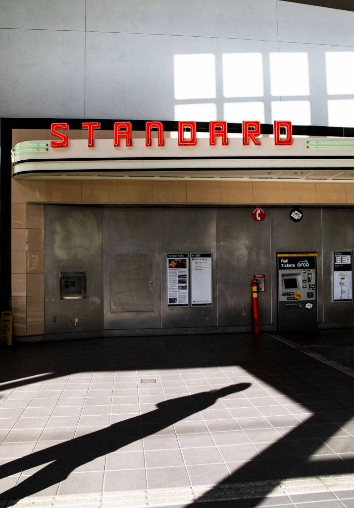 Standard Radios vintage neon sign lights at the entrance of Roosevelt Station on Oct. 14, 2024 in Seattle, Washington. (Olivia Vanni / The Herald)