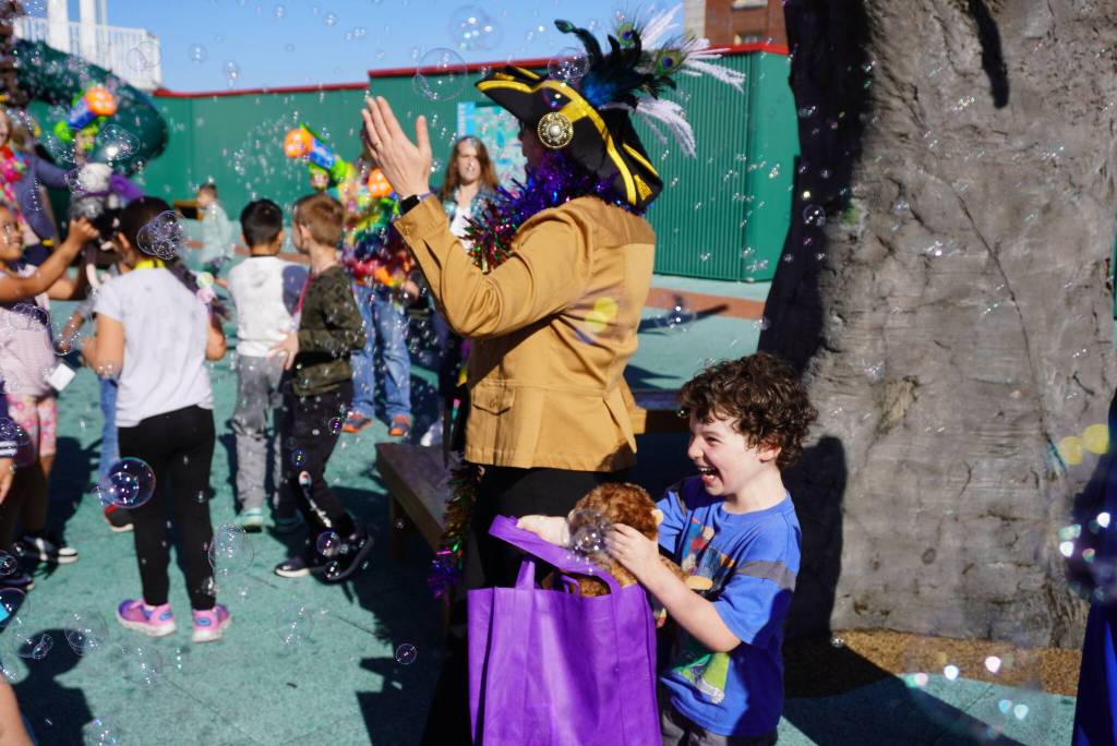 Aaron Weinstock yells in excitement after finding out he is the 4 millionth visitor to Imagine Children’s Museum in Everett. Aaron was given a lifetime family membership and a special “million bubble salute” on the museum’s rooftop playground August of 2024. (Photo courtesy of Imagine Children’s Museum)