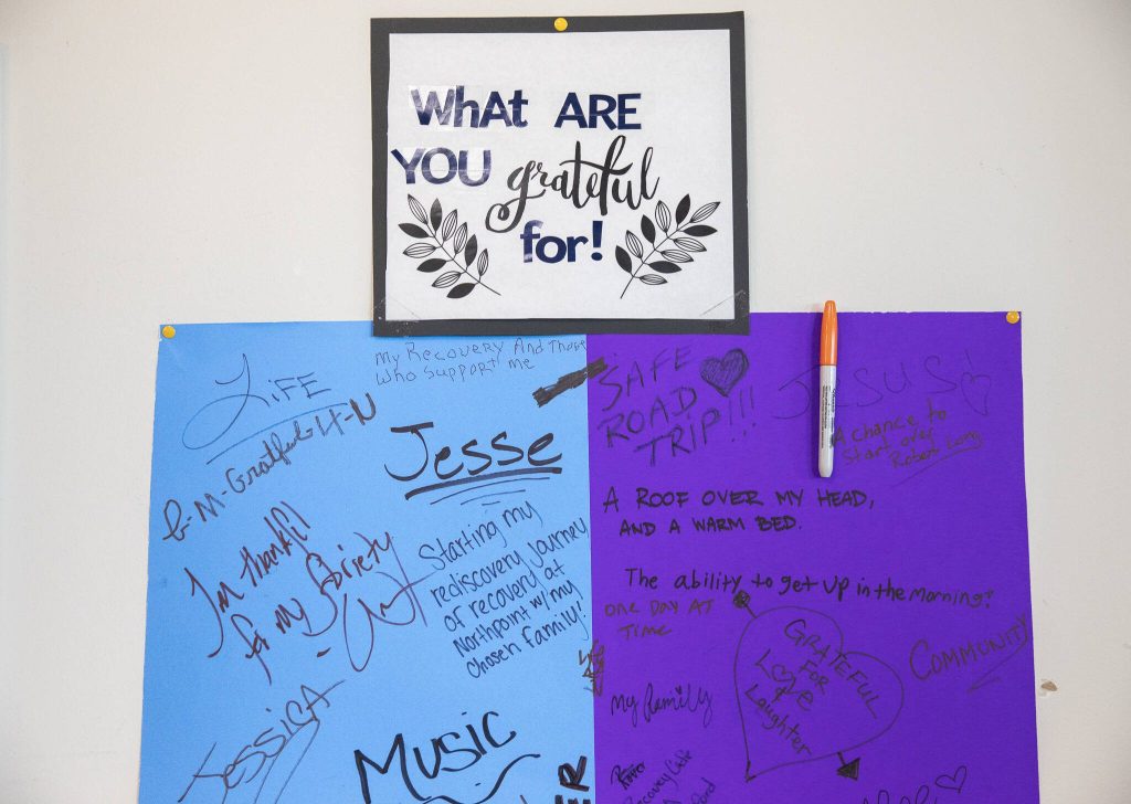 A poster filled with what people are grateful for hangs on a wall at Everett Recovery Cafe on Wednesday, Dec. 4, 2024 in Everett, Washington. (Olivia Vanni / The Herald)