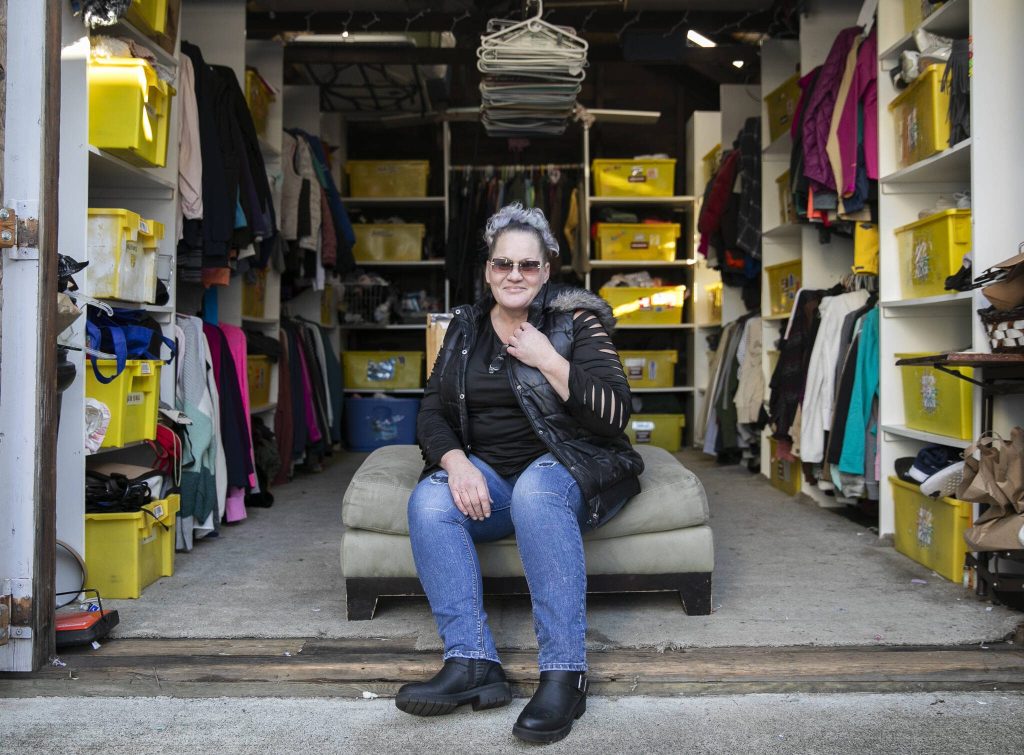 Esthers Place chaos coordinator Sandra Stringham at Esthers Place clothing pantry on Wednesday, Dec. 4, 2024 in Everett, Washington. (Olivia Vanni / The Herald)