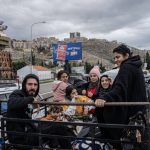 Residents from the south celebrate as they return to their homes, south of Beirut, Nov. 27, 2024. A cease-fire meant to end the deadliest war in decades between Israel and the Lebanese militant group Hezbollah officially took effect early Wednesday, less than a day after President Biden announced the deal and Israel approved its terms. (Daniel Berehulak /The New York Times)