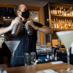 Kyle Galvin, who has worked for Bluewater for more than 4 years, makes cocktails on July 10, 2020 in Everett. (Olivia Vanni / The Herald)