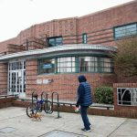 People walk into the Everett Library off of Hoyt Avenue on Tuesday, Dec. 3, 2024 in Everett, Washington. (Olivia Vanni / The Herald)