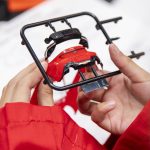 Elizabeth Gonzales, 8, checks to see if her car bumper fits during Toyota Mini Makers Garage on Monday, Dec. 9, 2024 in Marysville, Washington. (Olivia Vanni / The Herald)
