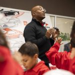 Alan Williams leads the Junior Makers at Toyota Mini Makers Garage through instructions on how to assemble their miniature cars on Monday, Dec. 9, 2024 in Marysville, Washington. (Olivia Vanni / The Herald)