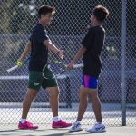 Jacksons Ben Lee, left, high-fives teammate Samuel Song, right, during a match against Kamiak on Monday, Sept. 30, 2024 in Mill Creek, Washington. (Olivia Vanni / The Herald)