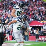Seahawks receiver Jake Bobo (19) celebrates with running back Zach Charbonnet (26) after a touchdown during the Seahawks 30-18 victory at State Farm Stadium on Sunday, Dec. 8, 2024. (Photo courtesy of the Seattle Seahawks)