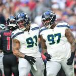 Seahawks defensive tackles Byron Murphy II (91) and Johnathan Hankins (97) celebrate after a defensive play against the Arizona Cardinals at State Farm Stadium on Sunday, Dec. 8, 2024. (Photo courtesy of the Seattle Seahawks)