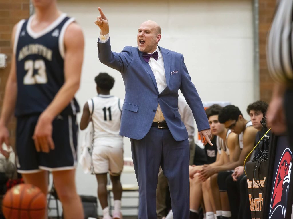 Mountlake Terrace head coach Johnny Phillips yell instructions to his player during the game against Arlington on Tuesday, Dec. 10, 2024 in Mountlake Terrace, Washington. (Olivia Vanni / The Herald)