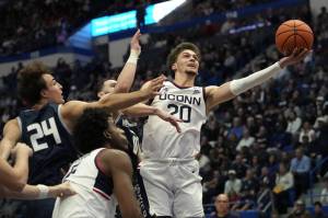 Connecticuts Aidan Mahaney (20) puts up a shot against New Hampshire during the first half at the XL Center on Saturday, Nov. 9, 2024, in Hartford, Connecticut. (Joe Buglewicz / Getty Images / Tribune News Services)