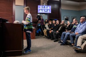 Rhys Stenhouse, 13, speaks to the Everett City Council and encourages them to build a new stadium by quoting 'Field of Dreams' during public comment before the council's vote on the stadium site location on Wednesday, Dec. 18, 2024 in Everett, Washington. (Olivia Vanni / The Herald)