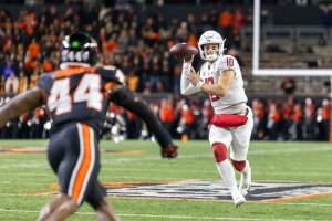 Washington State quarterback John Mateer (#10) throws on the run as the Cougars face the Oregon State Beavers in a college football game at Reser Stadium in Corvallis on Saturday, Nov. 23, 2024. (Sean Meagher / Tribune News Services)