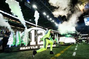 Seahawks linebacker Ernest Jones IV sprints onto Lumen Field during pregame introductions prior to a game against the Green Bay Packers on Sunday, Dec. 15, 2024. (Photo courtesy of Rod Mar / Seattle Seahawks)