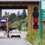 A passenger pays their fare before getting in line for the ferry on Sept. 28, 2023 in Mukilteo, Washington. (Olivia Vanni / The Herald)