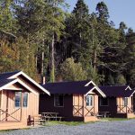 Cabins ready to greet the sunset Friday afternoon at Cama Beach Historical State Park on Camano Island in 2019. (Kevin Clark / The Herald)
