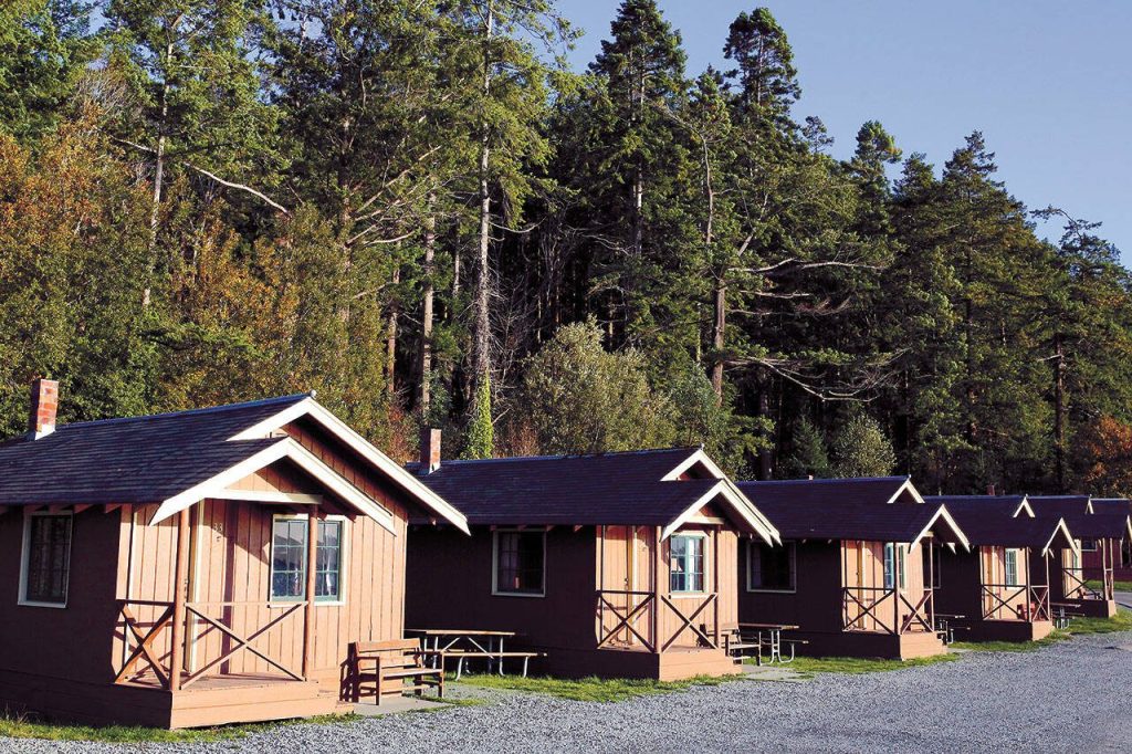 Cabins ready to greet the sunset Friday afternoon at Cama Beach Historical State Park on Camano Island in 2019. (Kevin Clark / The Herald)