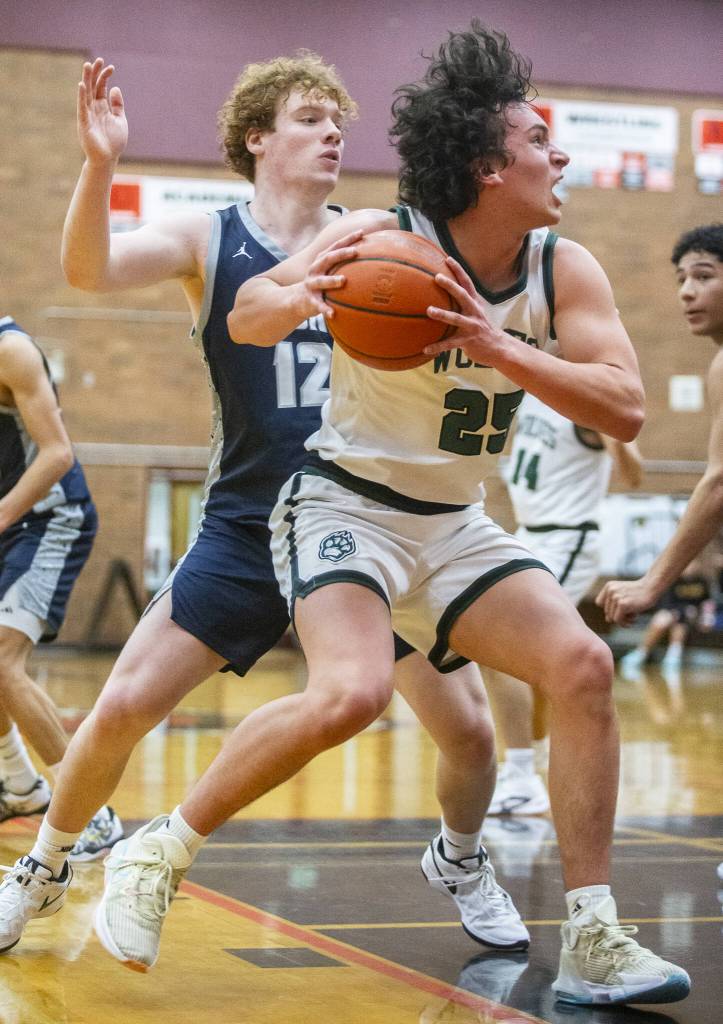 Jacksons Hawkeye Delgado drives to the hoop for a layup during the game against Squalicum on Friday, Dec. 27, 2024 in Mountlake Terrace, Washington. (Olivia Vanni / The Herald)