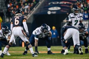 Former Archbishop Murphy High School stars, Bears cornerback Kyler Gordon (6) and Seahawks right tackle Abraham Lucas (72), prepare for play at Soldier Field in Chicago on Dec. 26, 2024. (Photo courtesy of Edwin Hooper / Seattle Seahawks)