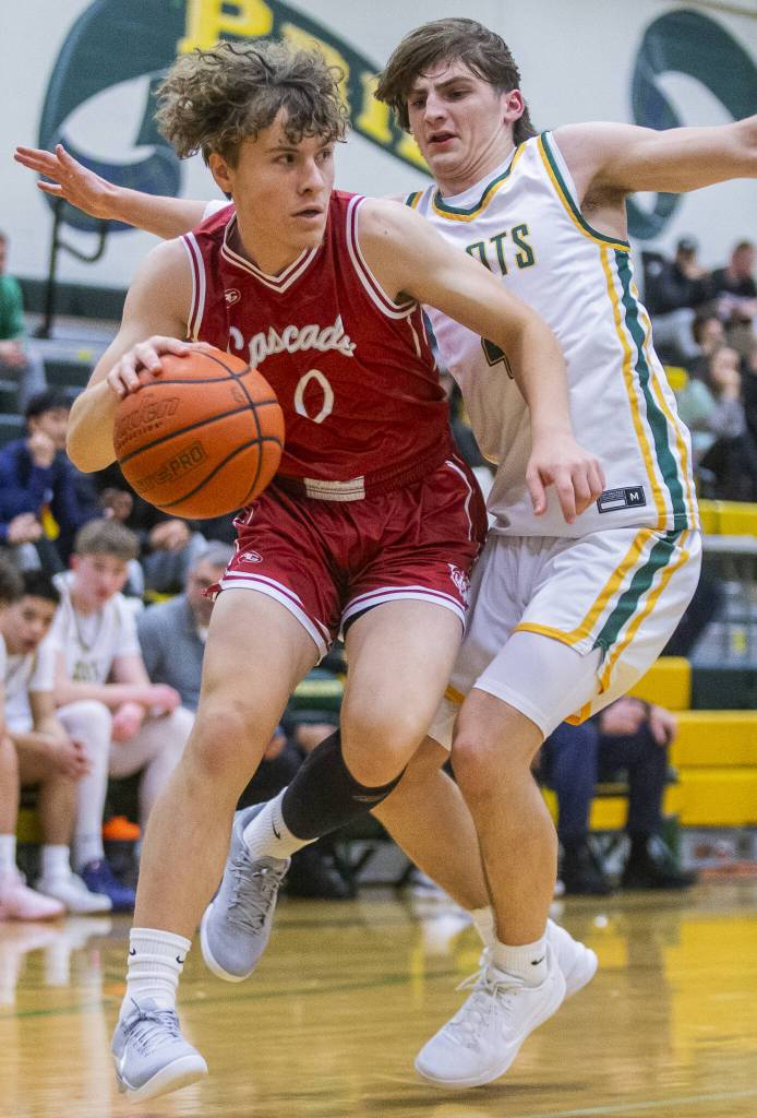Cascades Mason Zimmerman tries to get around Shorecrests Porter Swanson during the game against Cascade on Monday, Dec. 30, 2024 in Shoreline, Washington. (Olivia Vanni / The Herald)