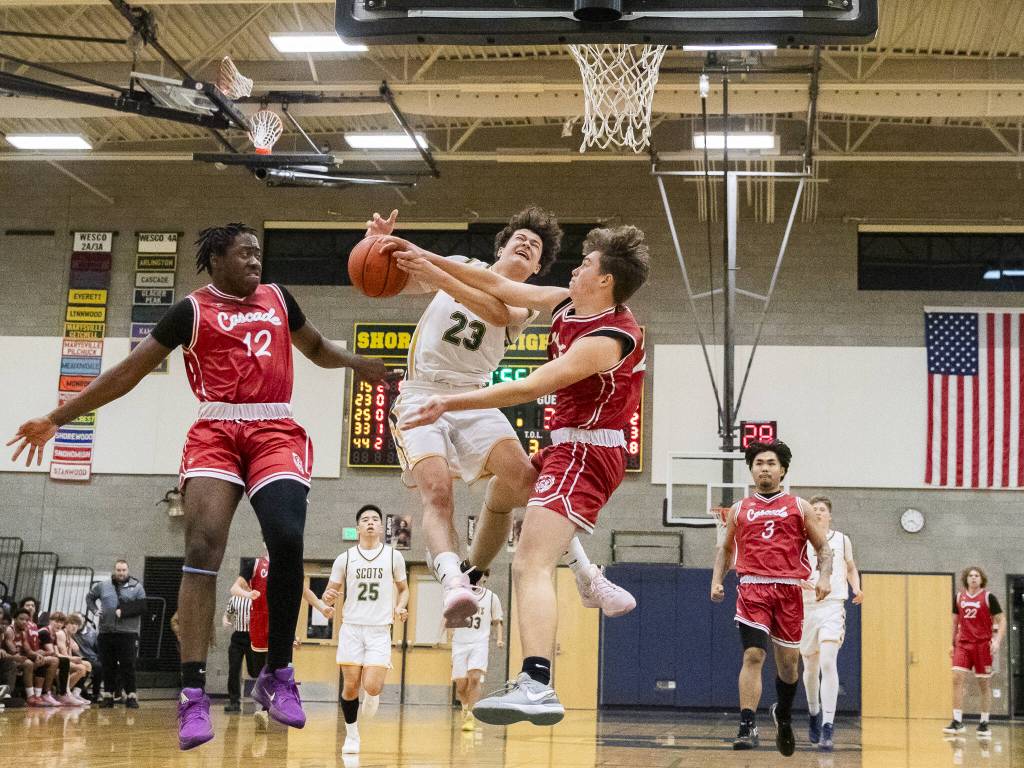Shorecrests Tyson Laconia has his shot blocked and is fouled during the game against Cascade on Monday, Dec. 30, 2024 in Shoreline, Washington. (Olivia Vanni / The Herald)