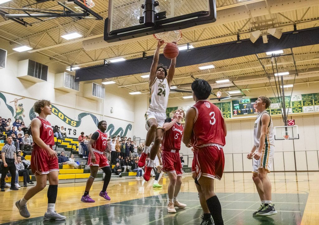 Shorecrests Devan Jones dunks the ball during the game against Cascade on Monday, Dec. 30, 2024 in Shoreline, Washington. (Olivia Vanni / The Herald)