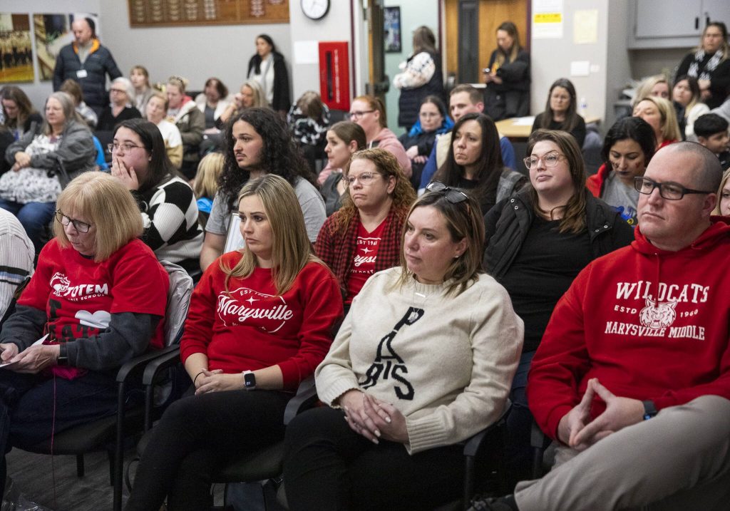 People listen as the Marysville School Board votes to close an elementary and a middle school in the 2025-26 school year while reconfiguring the districts elementary schools to a K-6 model on Wednesday, Jan. 22, 2025 in Marysville, Washington. (Olivia Vanni / The Herald)