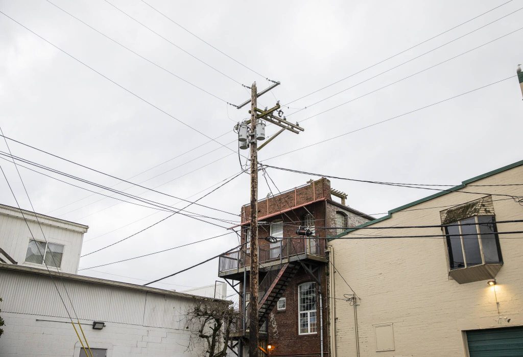 Power and internet lines visible within the proposed stadium site on Monday, Dec. 30, 2024 in Everett, Washington. (Olivia Vanni / The Herald)
