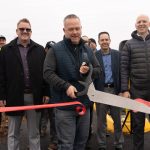 Lake Stevens Mayor Brett Gailey cuts the ribbon to open Phase 0 of the Bayview Trail in Lake Stevens. Jan. 6, 2025 (Will Geschke / The Herald)