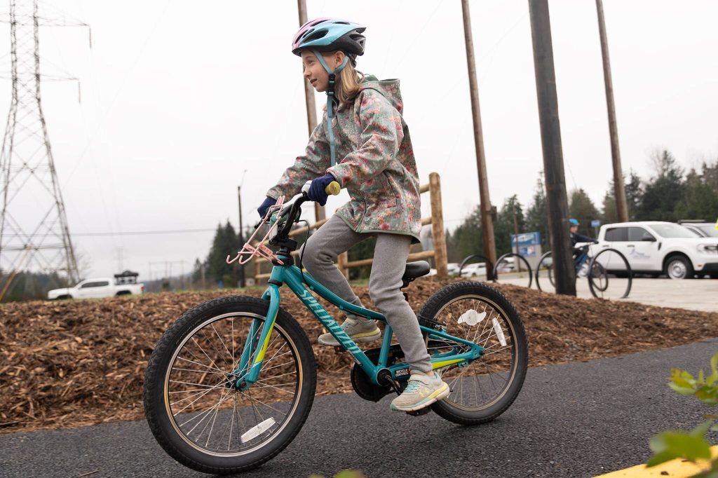 Photos by Will Geschke / The Herald
Emma Hill rides a bike along Phase 0 of the Bayview Trail in Lake Stevens on Monday.