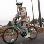 Emma Hill rides a bike along Phase 0 of the Bayview Trail on Jan. 6, 2025 in Lake Stevens, Washington. (Will Geschke / The Herald)