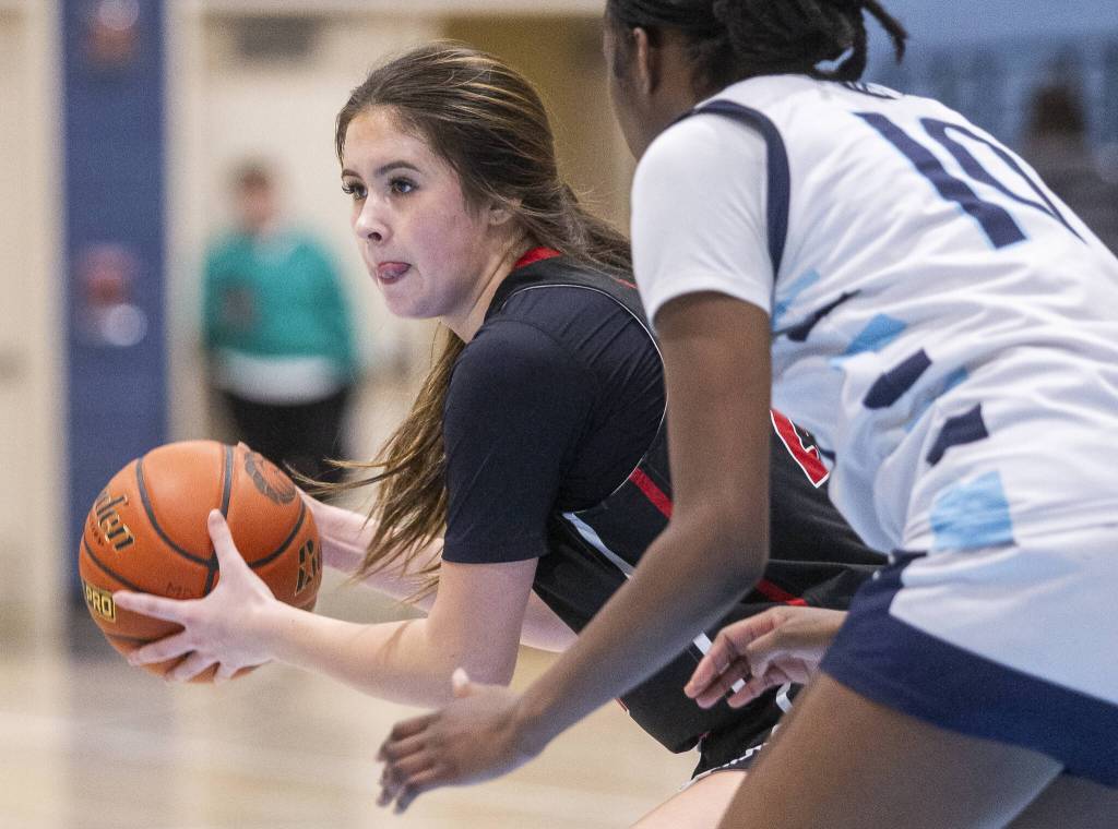 Archbishop Murphys Ava Marr looks for an open teammate to pass to during the game against Meadowdale on Friday, Jan. 3, 2025 in Lynnwood, Washington. (Olivia Vanni / The Herald)