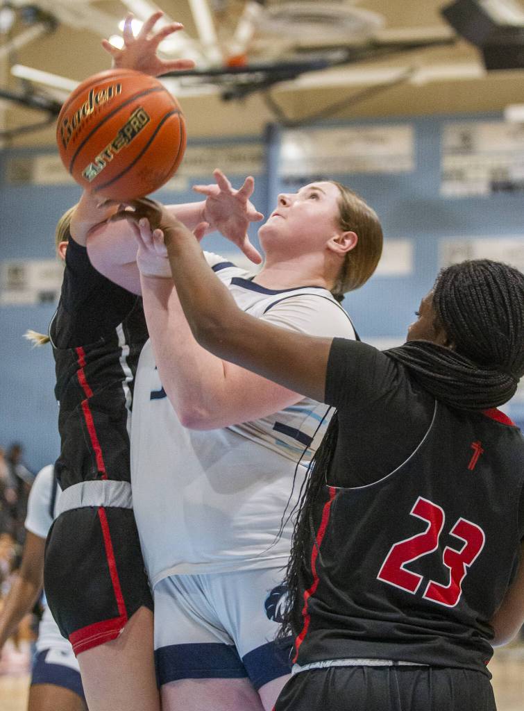 Meadowdales Audrey Lucas is fouled while trying to make a layup during the game Archbishop Murphy on Friday, Jan. 3, 2025 in Lynnwood, Washington. (Olivia Vanni / The Herald)